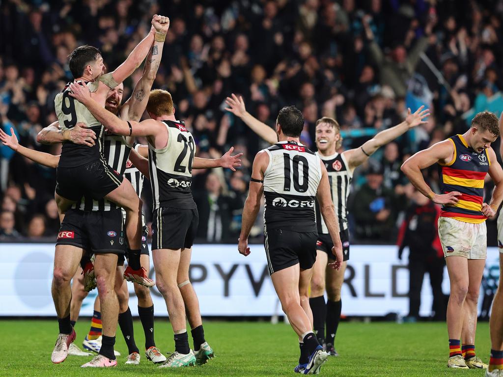 Power players celebrate in the final term. Picture: Sarah Reed/AFL Photos