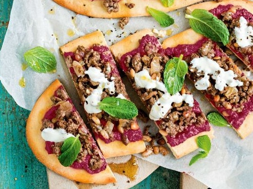 Lamb flatbread pizzas with beetroot hummus.