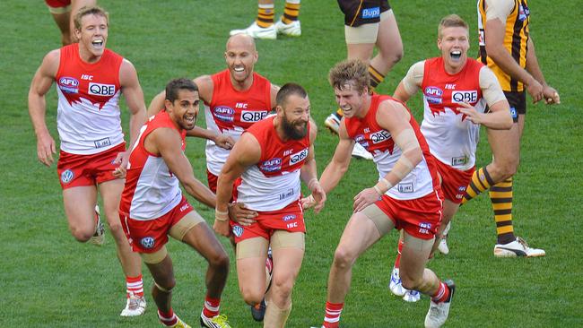 Sydney teammates swamp Nick Malceski after his Grand Final-winning goal Picture: George Salpigtidis