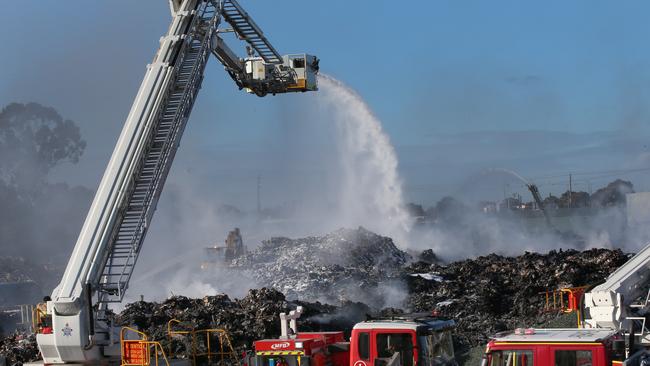 Firefighters fight the Coolaroo recycling plant fire in July. Picture: David Crosling