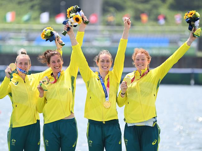 Australia’s Lucy Stephan, Rosemary Popa, Jessica Morrison and Annabelle Mcintyre celebrate on the podium following the women’s four final at the Tokyo Olympics. Picture: AFP