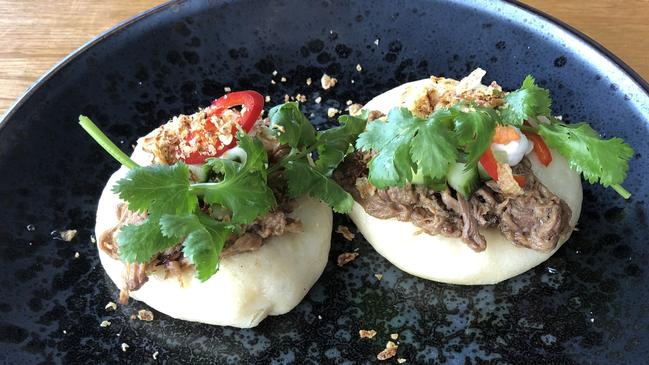 Steam bun with braised beef short rib, pickled cucumber and fried garlic at Jimmy Wah’s, Burleigh Heads. Picture: Supplied.