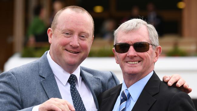 Trainers Wayne Hawkes (left) and John Hawkes (right) prepare Sirius Girl along with co-trainer Michael Hawkes. Picture: AAP Image