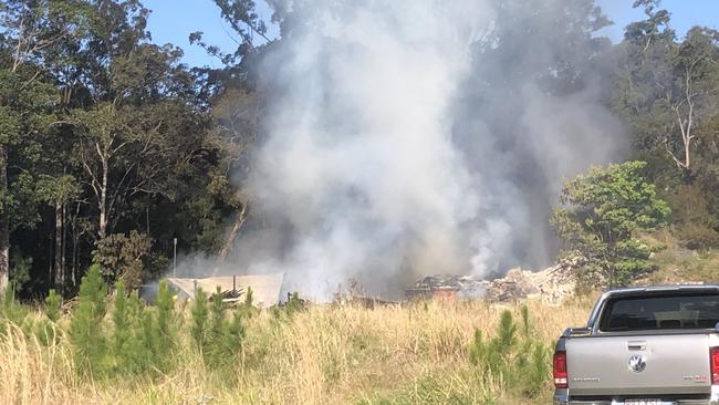 A large shed has gone up in flames on Steve Irwin Way in Glenview near the BP Service Station. Picture: Tyler Sluga