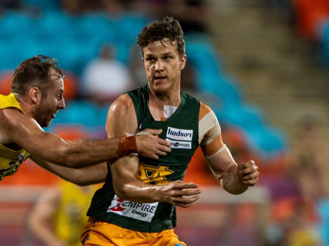 Kieran Parnell handballs for St Mary's against the Nightcliff Tigers in Round 1 of the 2024-25 NTFL season. Picture: Pema Tamang Pakhrin