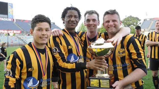 Parafield Gardens players (from left) Carlos Portillo, Paul Ebomo, Matthew Cockington and Louis Brain celebrate after yesterday’s Challenge Cup final win over Salisbury Inter. Picture: Noelle Bobrige