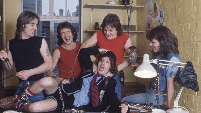 AC/DC: Phil Rudd, Bon Scott, Angus Young, Mark Evans, Malcolm Young, in London in 1976. Picture: Michael Putland/Getty Images