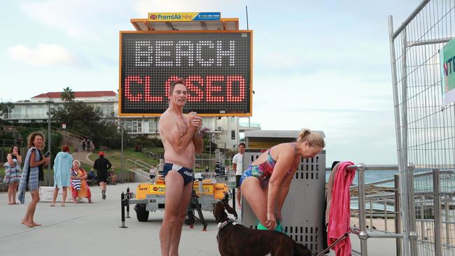 Locals wait for the beach to open at Bondi. Picture: John Feder