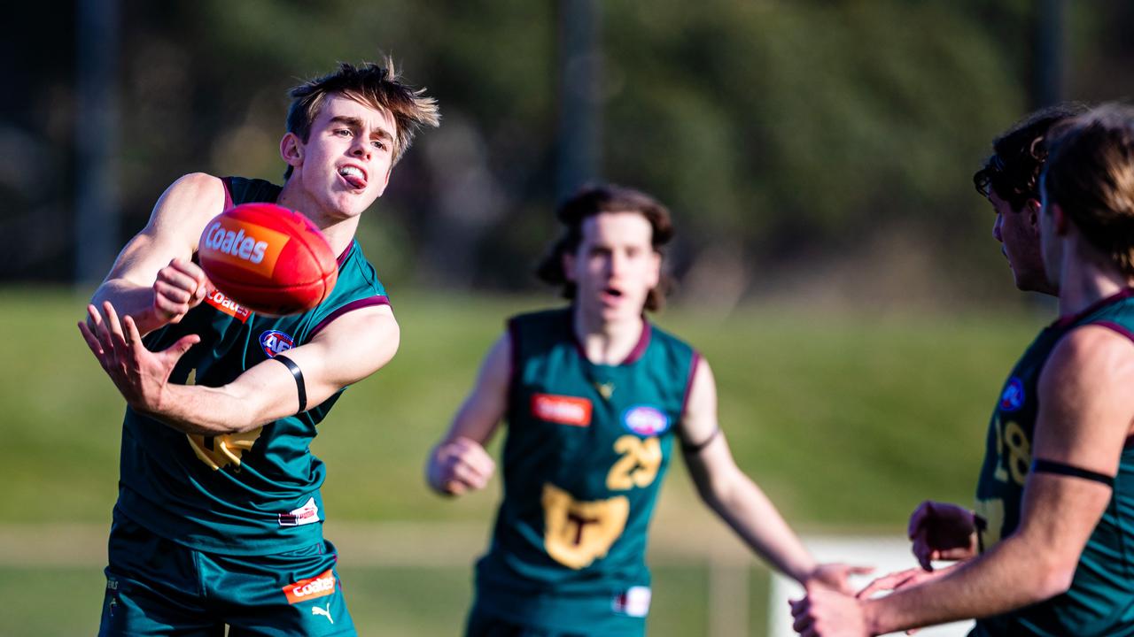 James Leake of Tasmania Devils gets the ball away. Picture: Linda Higginson