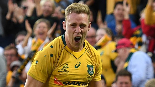 Reece Hodge celebrates scoring for Australia against Italy in Brisbane last month.