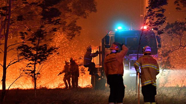 Firefighters as they battle against bushfires around the town of Nowra in NSW. (Picture: Saeed Khan/AFP)