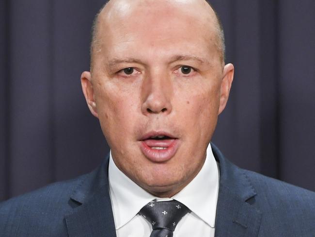 Australian Home Affairs Minister Peter Dutton speaks to the media during a press conference at Parliament House in Canberra, Monday, May 7, 2018. (AAP Image/Lukas Coch) NO ARCHIVING