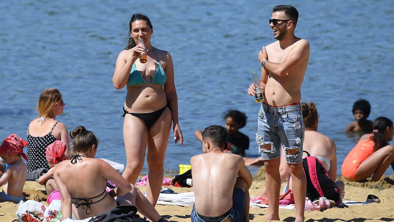 People enjoy the sunshine at Ruislip Lido in west London. Picture: Justin Tallis/AFP