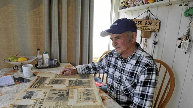 Jockey Paul Alderman, who rode Floating High to victory in the Ramornie Handicap in 1974, looks at one of his scrapbooks of old newspaper clippings. Picture: Tim Jefferies