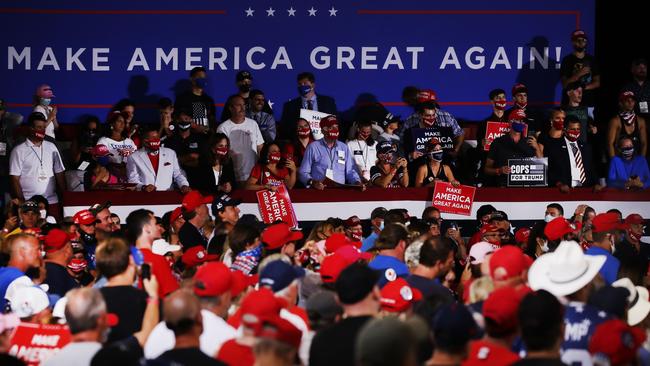 Trump supporters listen as he speaks at an airport hanger at a rally in Londonderry, New Hampshire last week. Picture: AFP.