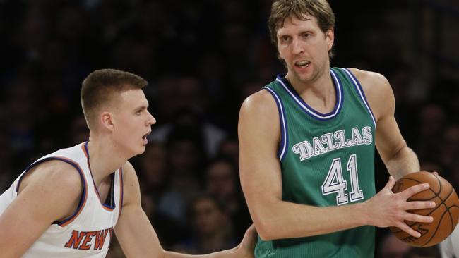 New York Knicks forward Kristaps Porzingis, left, defends Dallas Mavericks' Dirk Nowitzki during the second half.