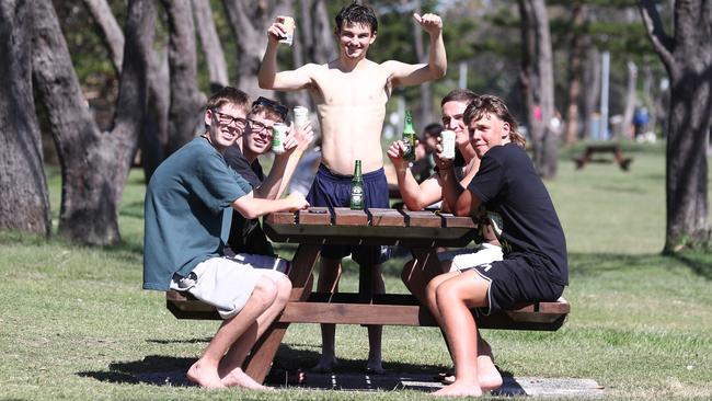 Sydney Schoolies catch up at Clarkes Beach in Byron Bay. Photograph: Jason O'Brien