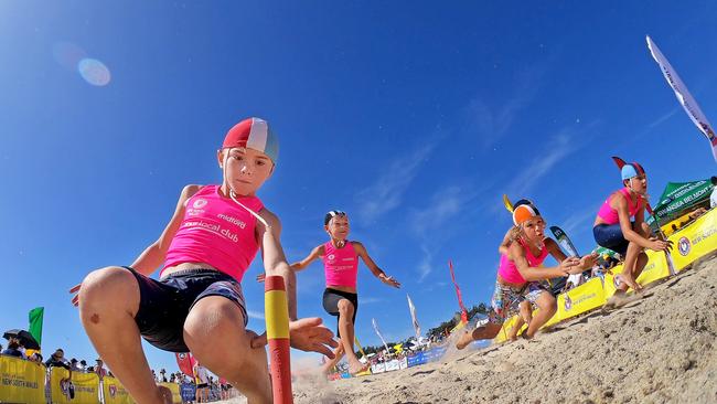 Competitors in action during the under-9 Male Flags event of the NSW Surf Life Saving Championships at Blacksmiths Beach on Friday, 28 February, 2020. Picture: Troy Snook