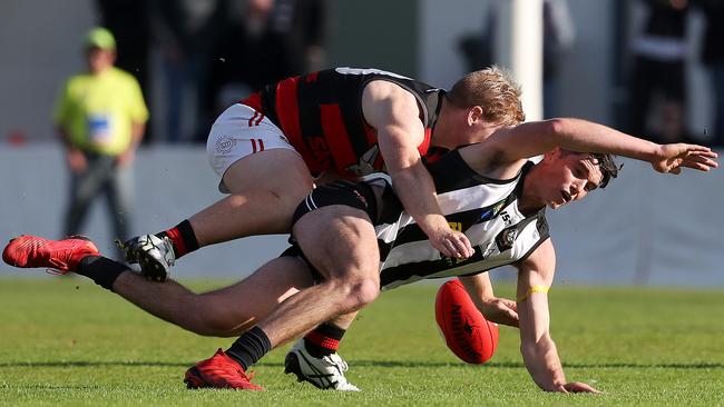 Bryce Walsh tackles Harrison Gunther in the Bombers-Pies clash last month. Picture: NIKKI DAVIS-JONES