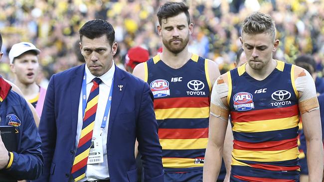 Crows CEO Andrew Fagan walks off the oval with the team after the 2017 Grand Final. Picture: Sarah Reed