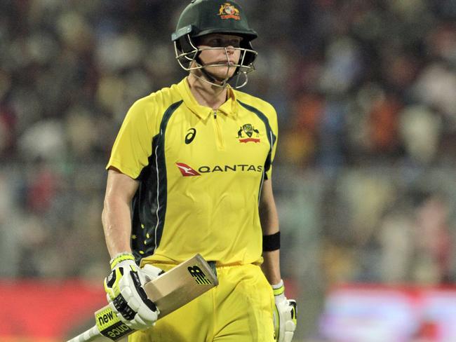 Australia's Steve Smith walks back to the pavilion after being dismissed for 59 runs.