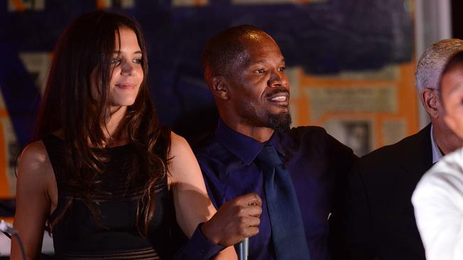 Katie Holmes and Jamie Foxx perform at the Apollo In The Hamptons Benefit in 2013.