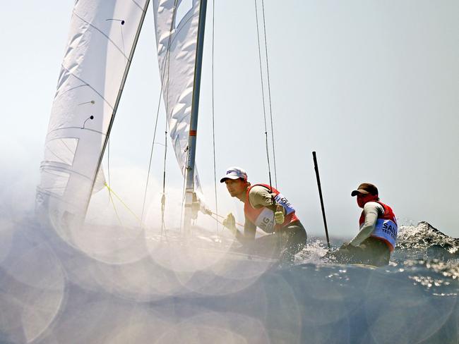 Sunlight hits water on the lens of the photographer, as Nia Jerwood and Conor Nicholas compete during a Mixed Dinghy Race in a sailing event in France. Picture: Clive Mason/Getty Images