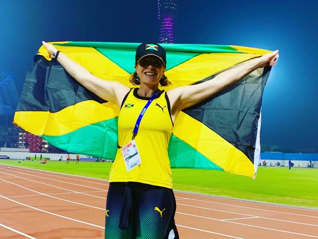 Dr Jo Brown with the Jamaican flag. Picture: Supplied.