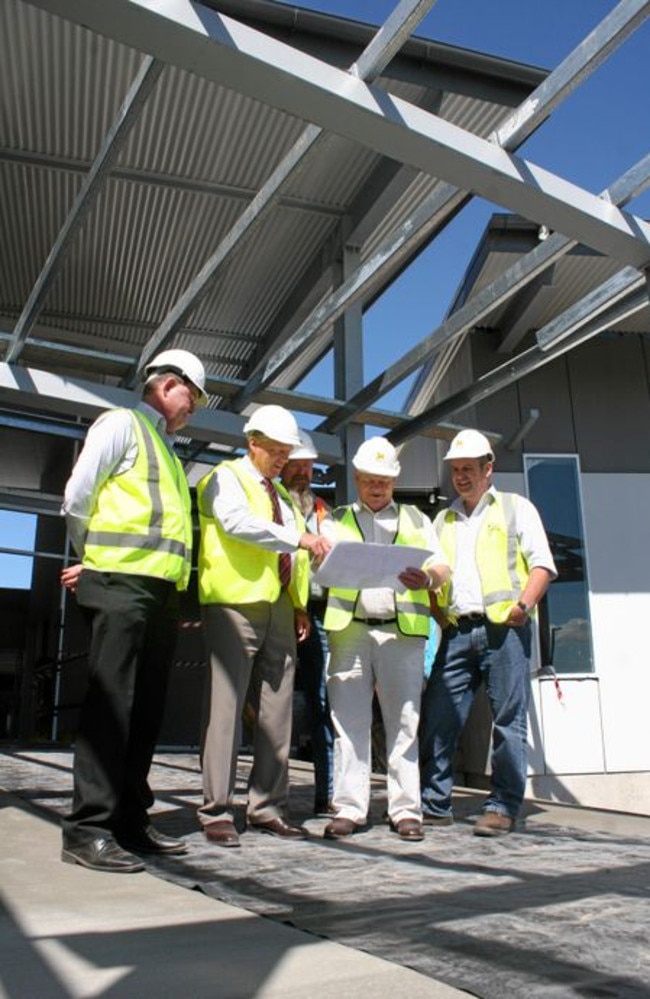 JM Kelly managing director Geoff Murphy and general manager John Murphy review plans of Banana Shire Council's new administration centre. Picture: Cameron McCrohon