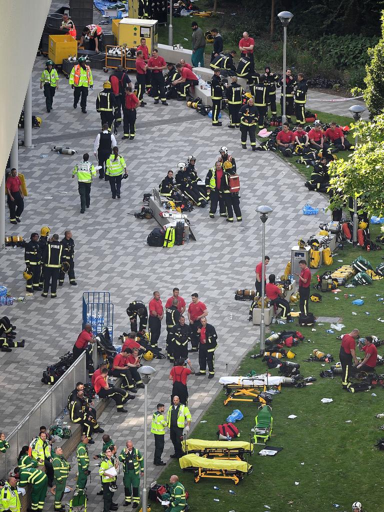 Firefighters and emergency service workers assemble near the Grenfell Tower. Picture: Leon Neal/Getty Images