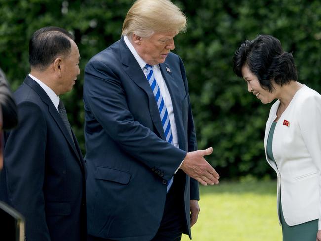 US President Donald Trump, centre, accompanied by former North Korean military intelligence chief Kim Yong Chol, left, greets Kim Song Hye, Head of the Committee for the Peaceful Reunification of Korea of the Korean Workers' Party outside the Oval Office. Picture: AP