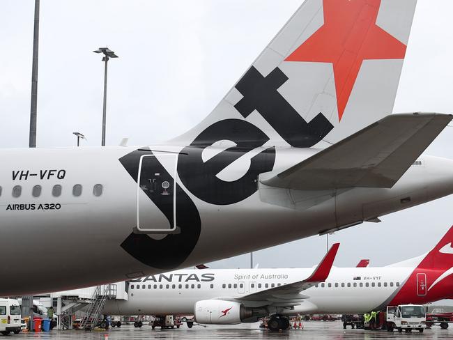 A Jetstar Airbus A380 and Qantas Boeing 737-800  jet aircraft at Cairns Airport after touchdown, bringing tourists and tourism dollars to Far North Queensland. Picture: Brendan Radkeescape december 6 2020 doc holiday