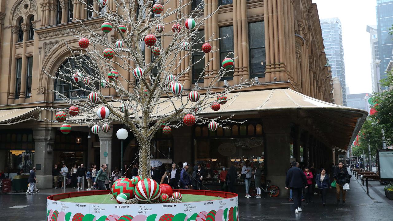 Crowds have braved the wet weather to get their shopping done. Picture: David Swift