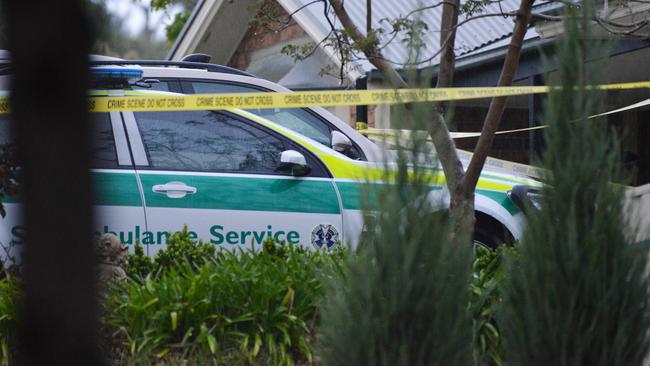 Police tape and an ambulance vehicle at the crime scene the morning after the incident. Picture: Brenton Edwards/AAP