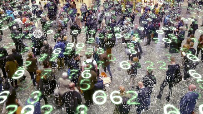 Binary code bursts from phones held by people with a matrix style overlay of glowing electronic numbers.
Digital privacy generic