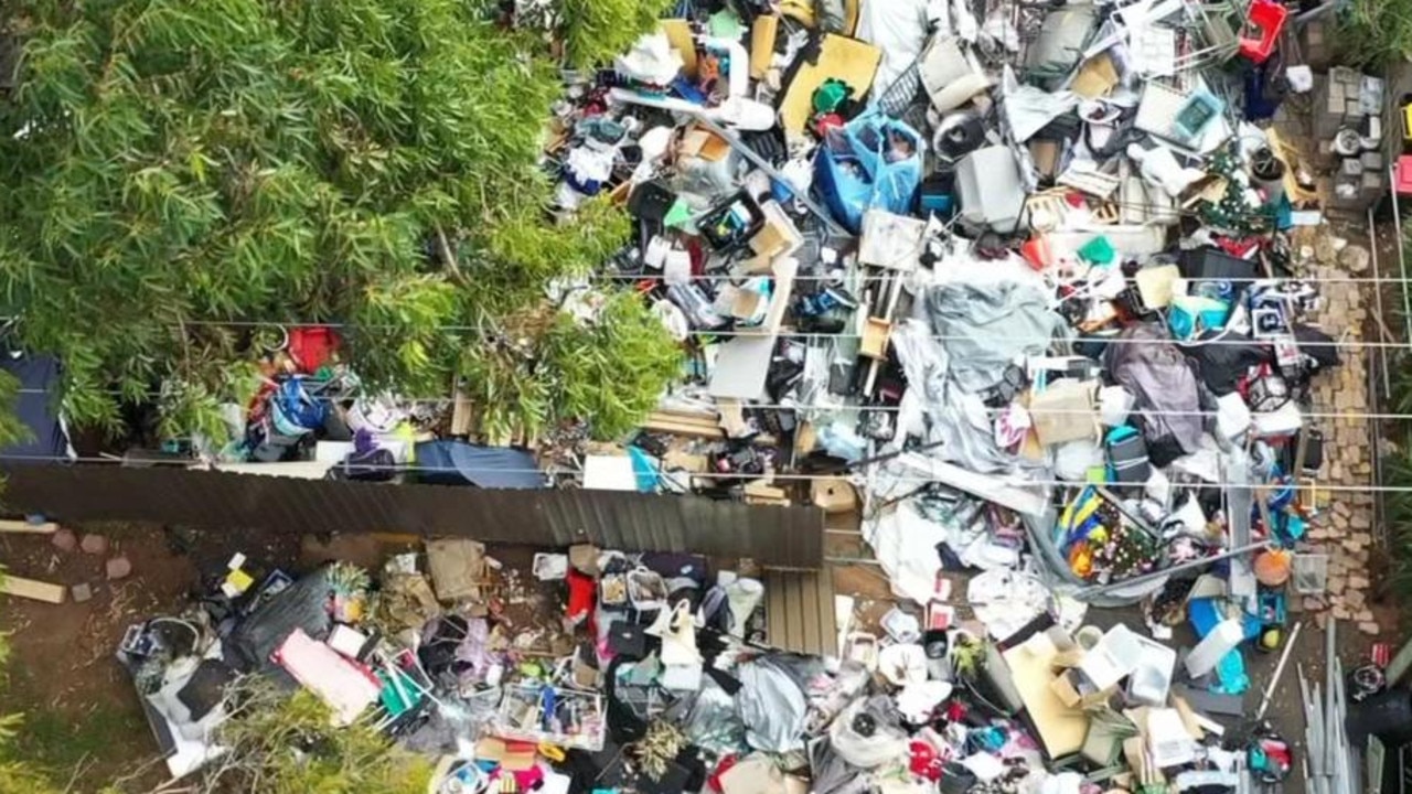 For more than a year junk has been piling up outside the home in Huntfield Heights, Adelaide. Picture: 7News