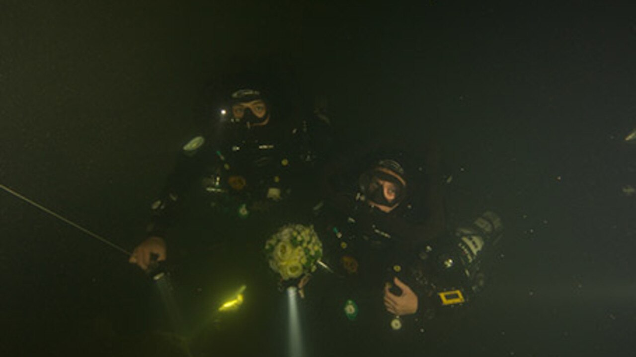 Hiro Yoshida and Sandra Smith during their recording breaking wedding 130m underwater. Picture: Guinness World Records