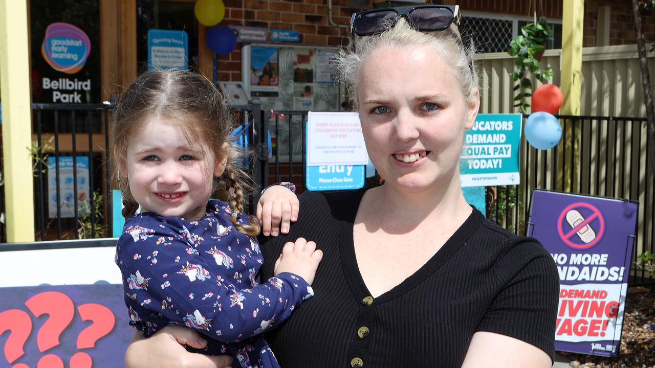 Crystal Bishell, with her daughter Miah, 3, supports the childcare workers in their protest. Picture: Liam Kidston