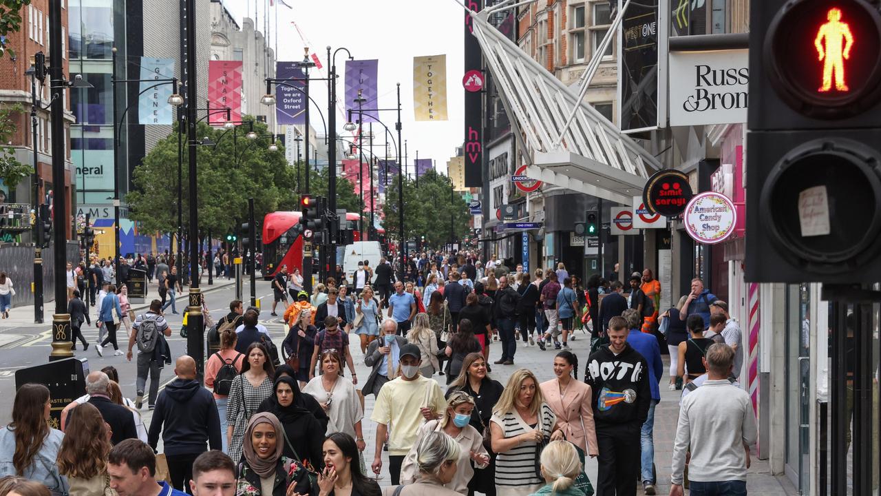 London’s Oxford Street shopping strip is heaving with few masks in sight. Photographer: Hollie Adam/Bloomberg via Getty Images.