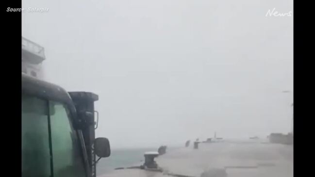 Tourists run for their lives in violent storm