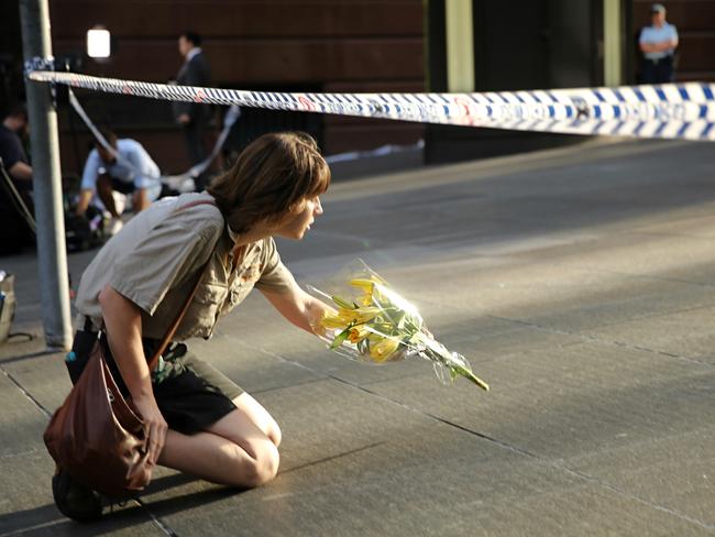 Erin Costelloe dropped flowers at Martin Place after the siege ended. Picture: John Grainger