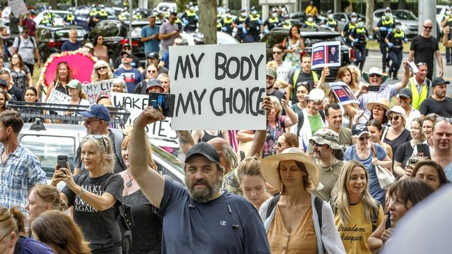 Protesters march at an anti-vVaccination protest in Melbourne. Picture: NCA NewsWire / David Geraghty