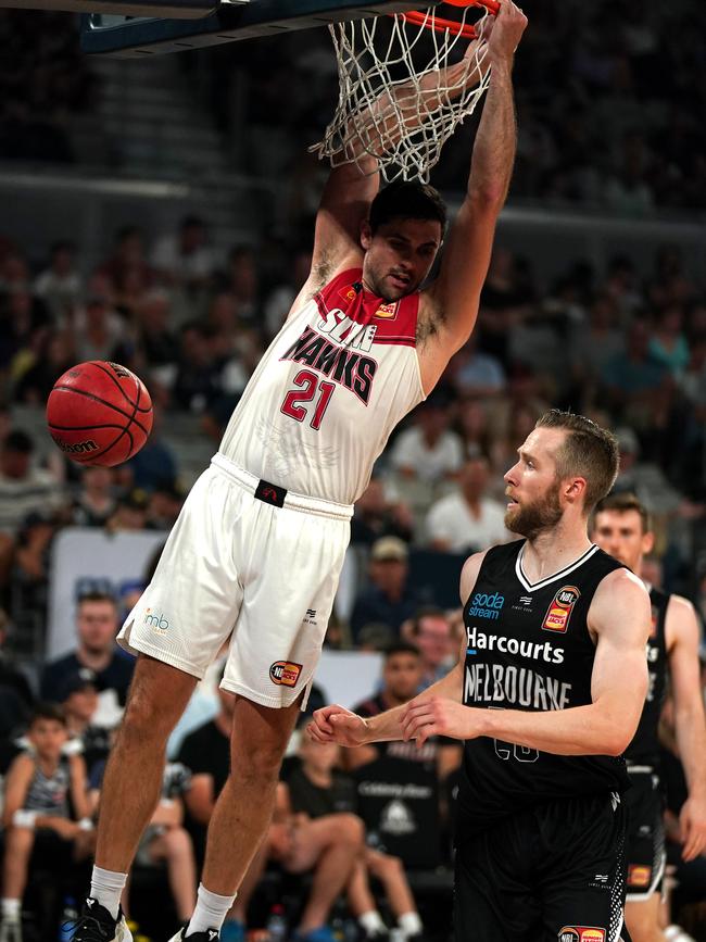 Todd Blanchfield hangs from the net in a rare highlight for the Hawks.