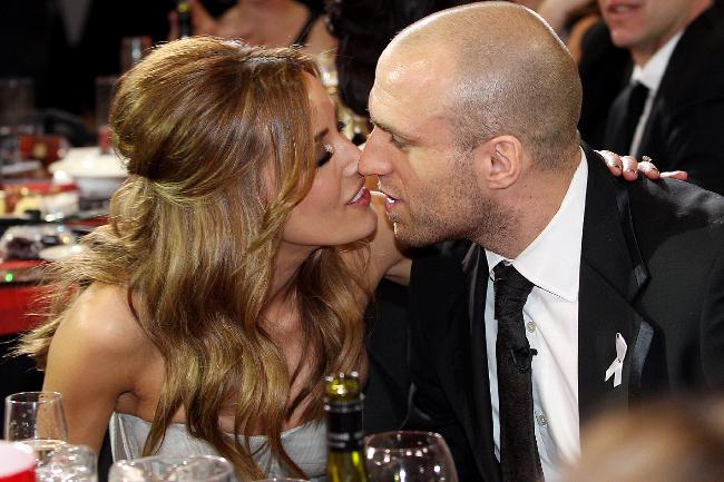 <p>Chris Judd gets a congratulation kiss from fiancee Rebecca Twigley. Picture: Michael Klein</p>