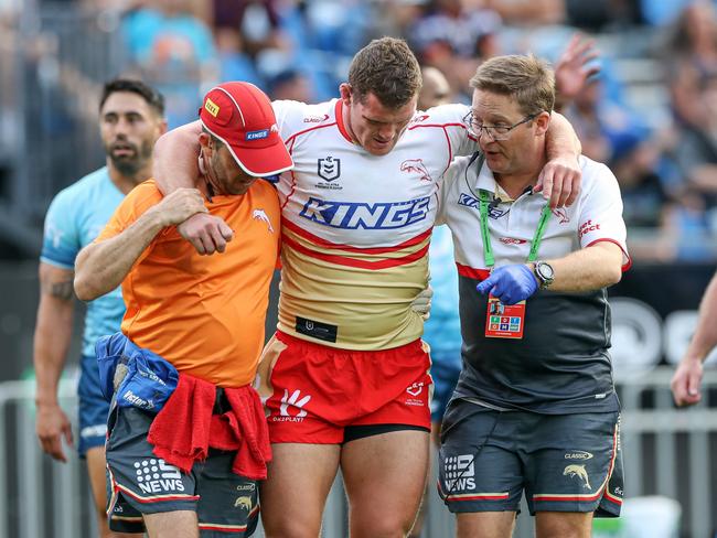 Tom Gilbert is helped form the field after injuring his ACL. Picture: NRL Photos