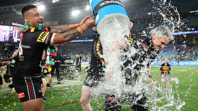 Cleary has an ice bucket poured over him by Spencer Leniu after winning the 2023 NRL Grand Final. (Photo by Matt King/Getty Images)