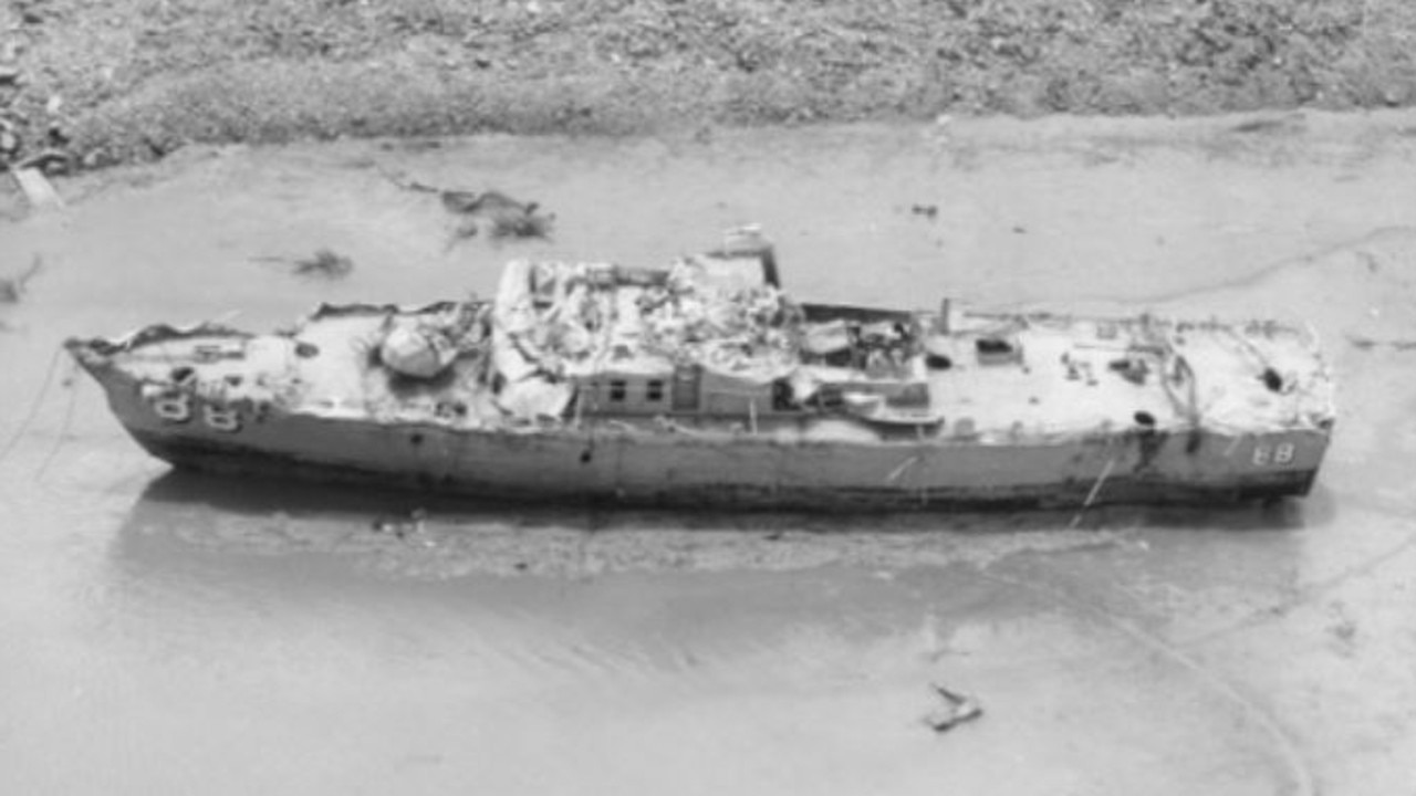 HMAS Arrow after being dredged up from the depths near Stokes Hill Wharf. Picture: The Sea Power Centre