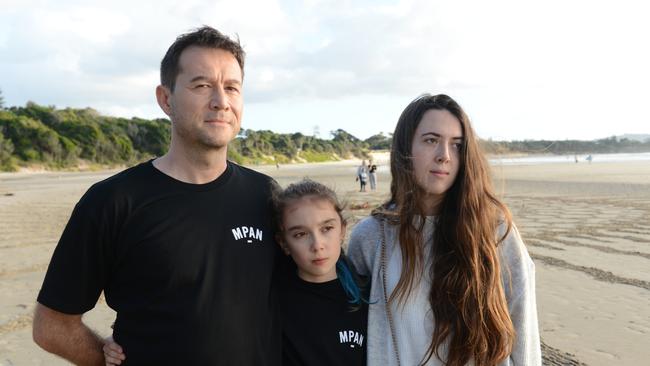 Jean-Phillippe Pector, godfather of missing Belgian backpacker Theo Hayez, with his daughter (centre) and Theo's cousin Lisa Hayez. They attended an event marking two years since Theo's disappearance at The Pass, Byron Bay. Picture: Liana Boss