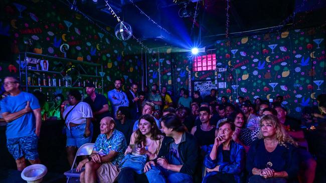 Supporters of Donald Trump break out the popcorn at a watch party. Picture: AFP