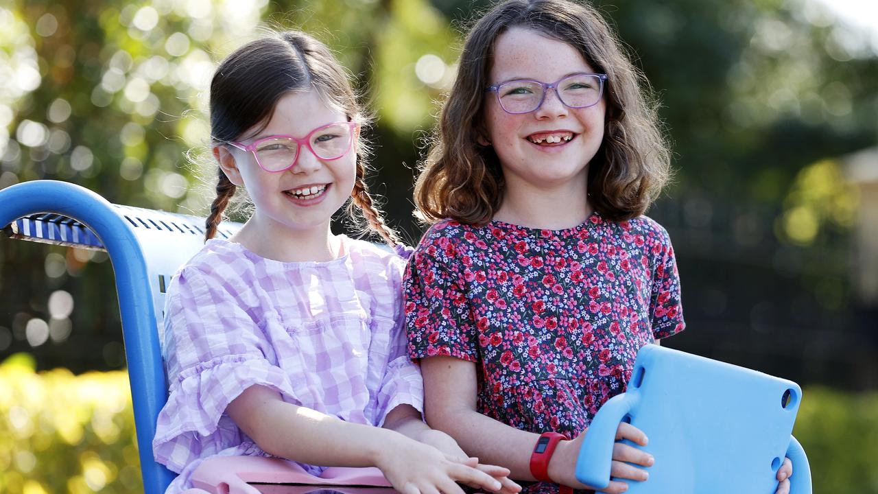 Besties Clementine Schofield and Georgie Payne, both 7, wear glasses and their parents have noticed an increase dependency on their vision support with the extra screen time caused by lockdowns. Picture: Tim Hunter
